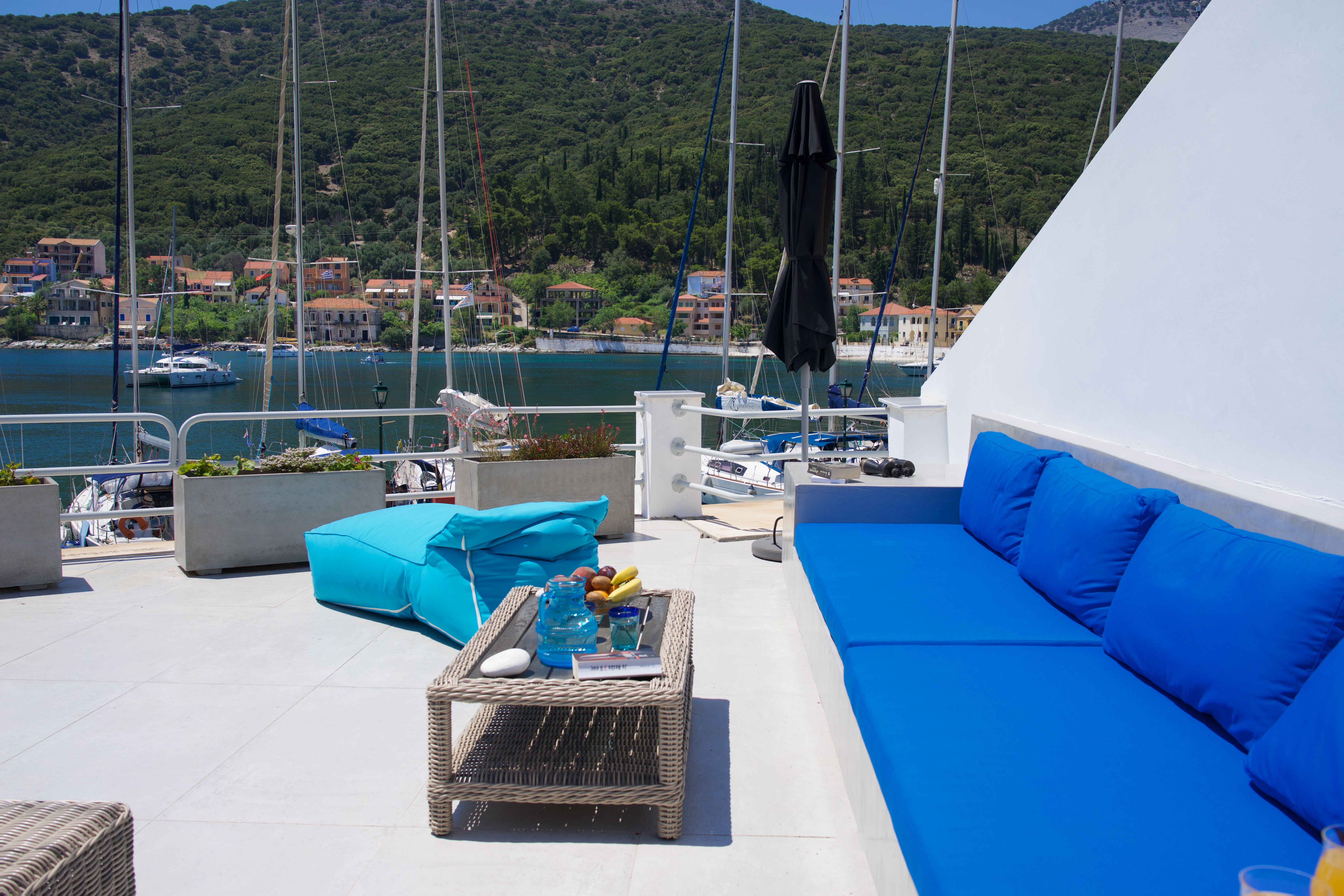 Bright and comfortable outside seating right on the waterfront at Palm House Harbourfront Mansion, Agia Efimia, Kefalonia, Greek Islands